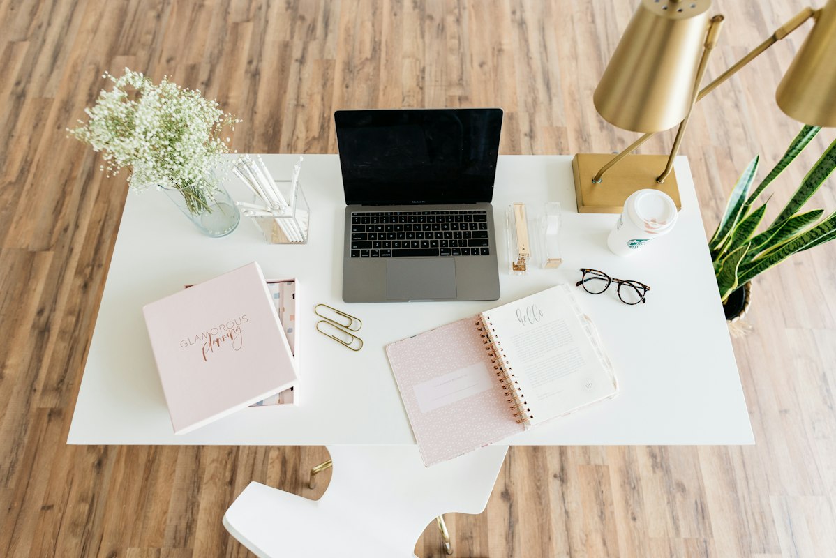 Wellness-focused workspace with plants, proper lighting, and movement space